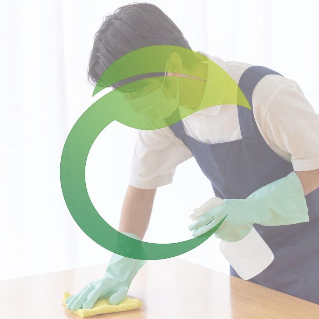 Professional cleaner disinfecting a table during a deep clean